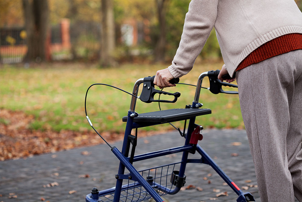 back-of-elderly-person--using-a-rollator-outside