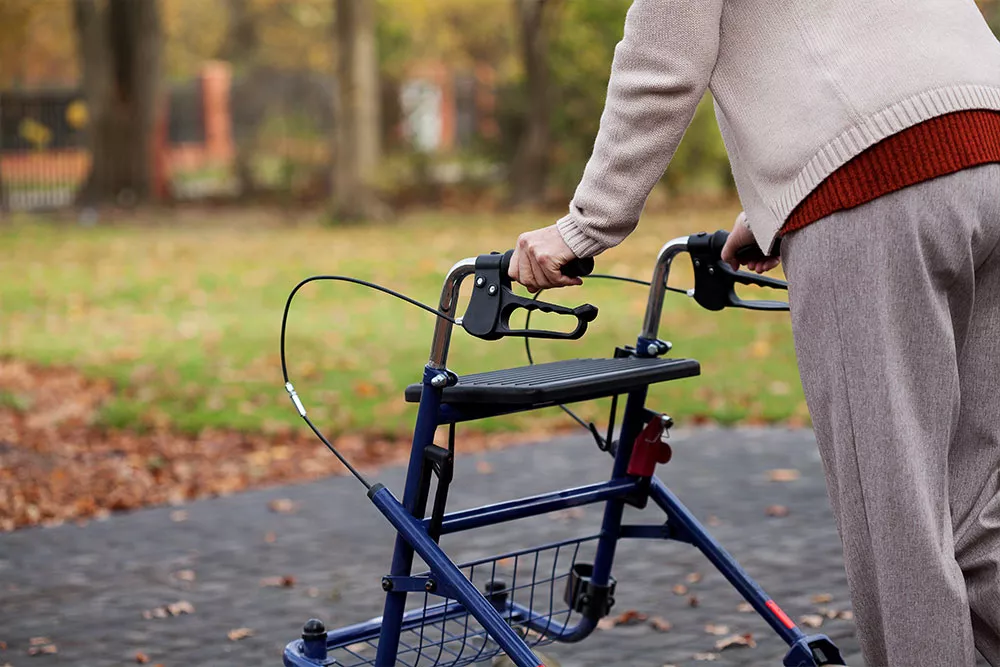 back-of-elderly-person--using-a-rollator-outside